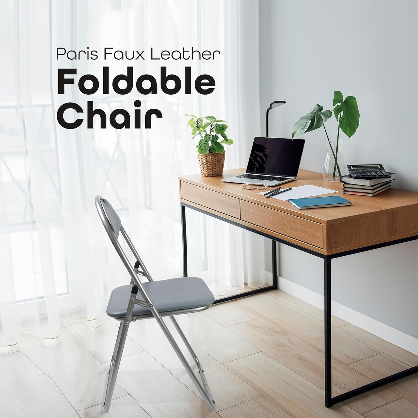 Foldable chair in front of a wooden desk with a laptop and plants, with text 'Paris Faux Leather Foldable Chair'.