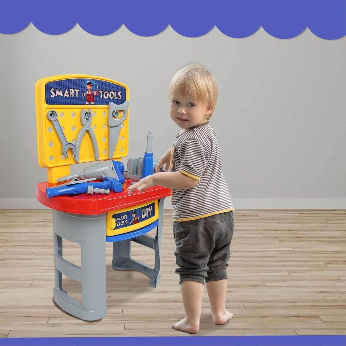 Child playing with the DIVCHI kids tool workbench