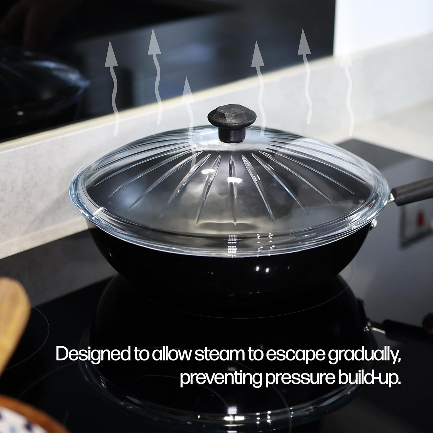 Glass pan lid allowing steam to escape while cooking