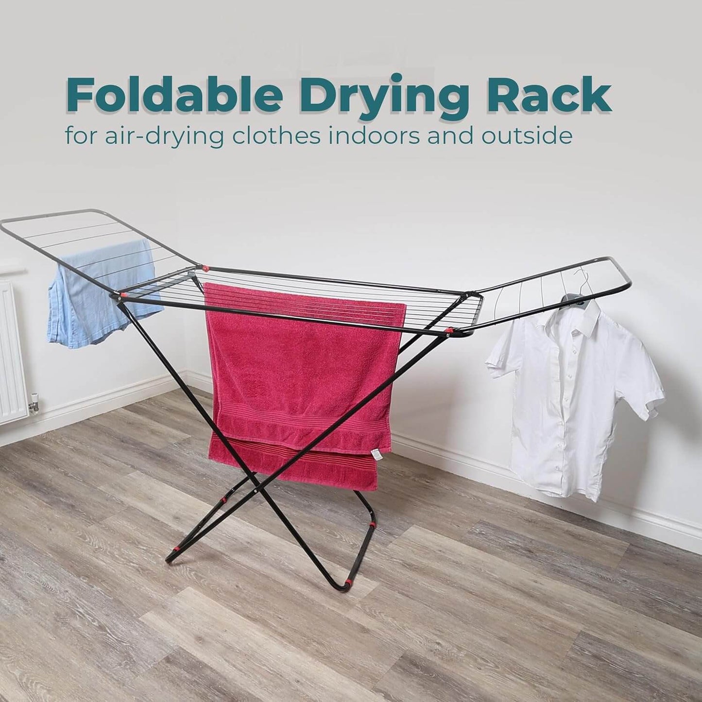 Foldable drying rack with laundry hanging, suitable for indoor and outdoor use