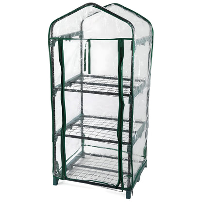 Small 3 tier greenhouse with clear plastic cover and green metal frame on a white background