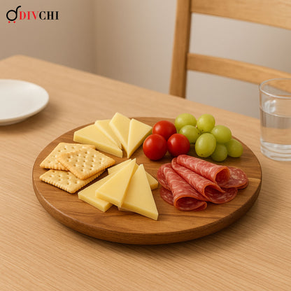 DIVCHI acacia Lazy Susan serving tray with cheese, crackers, tomatoes, grapes, and cold meats.