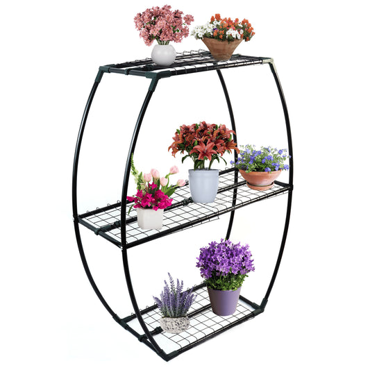 Black metal plant stand with multiple potted plants on a white background