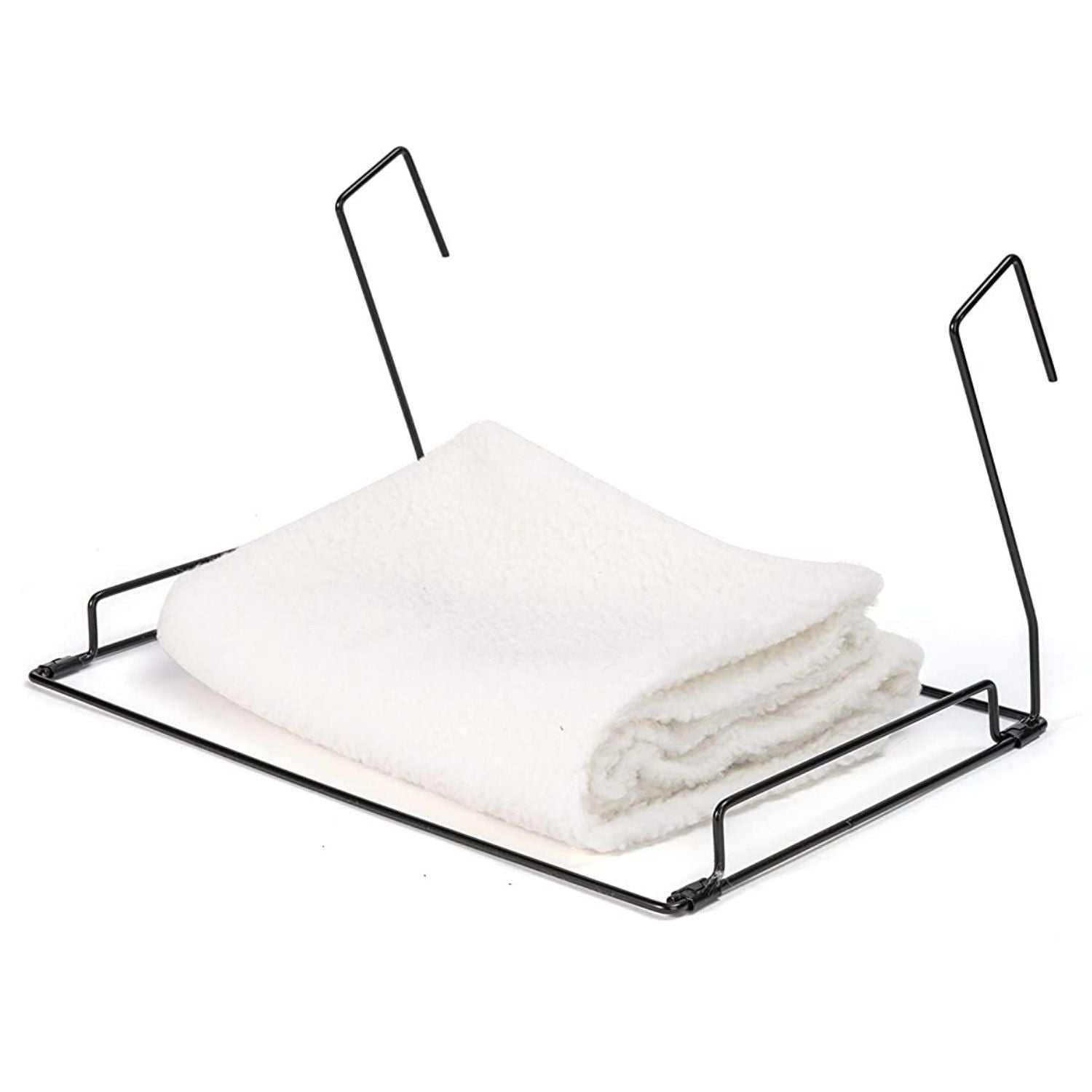 Folded white fleece cover and black metal frame for cat radiator bed.