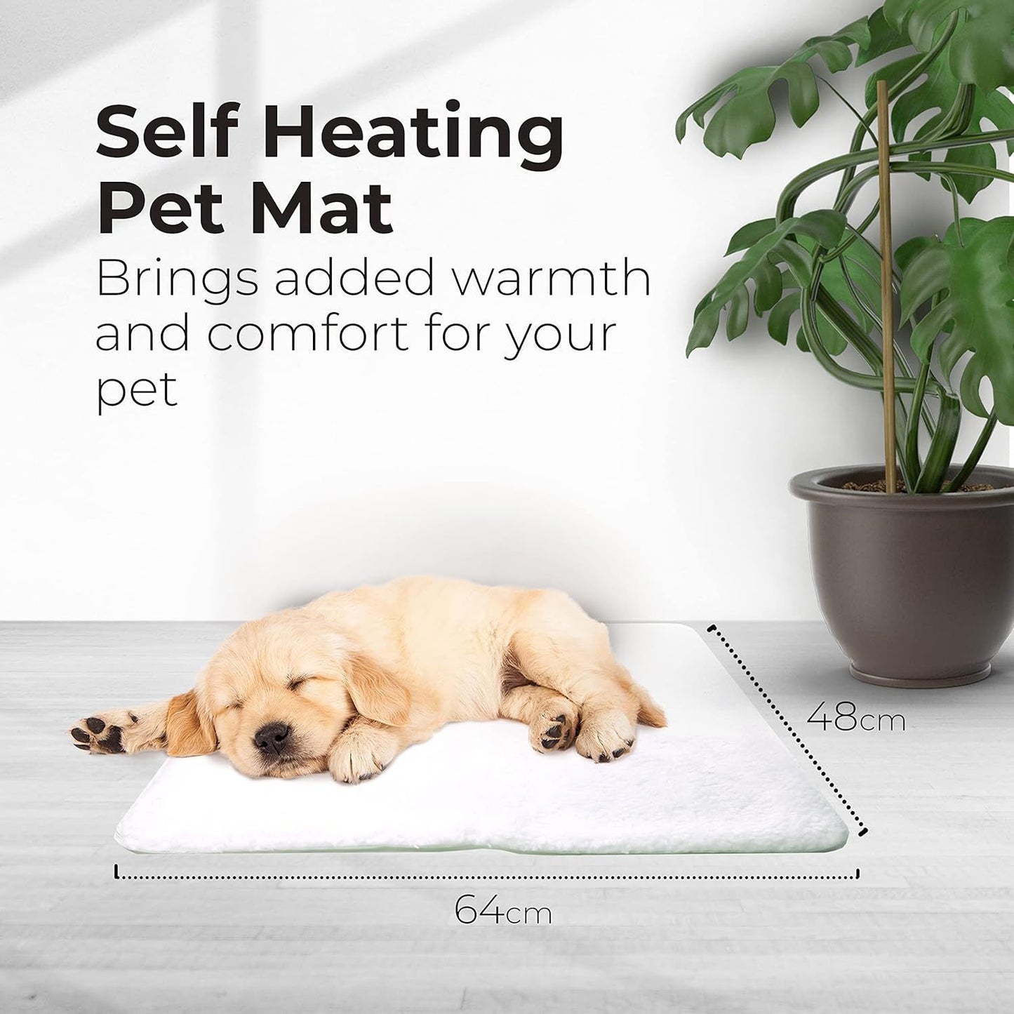 Golden retriever puppy asleep on white self-warming pet mat with dimensions 64cm x 48cm shown