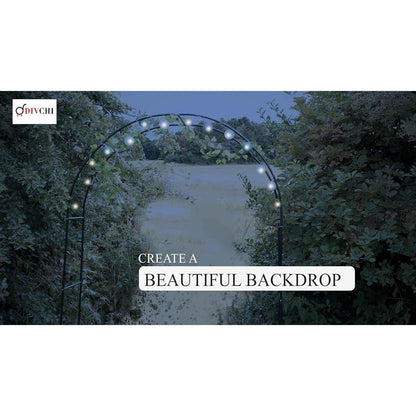Steel garden arch with string lights creating a beautiful outdoor night backdrop