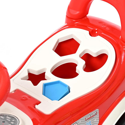 Red ride on car with seat lifted showing storage and shape sorter blocks