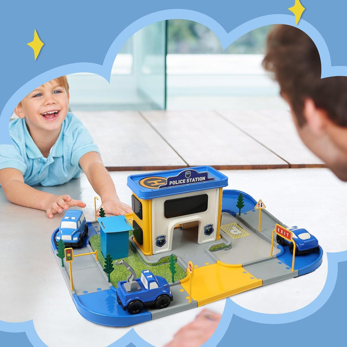 Happy child playing with police cars and the DIVCHI police station