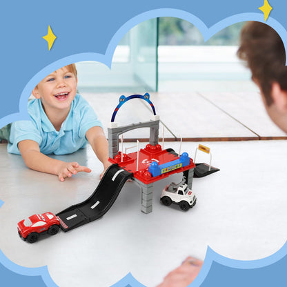Happy child racing toy cars down the DIVCHI playset ramp
