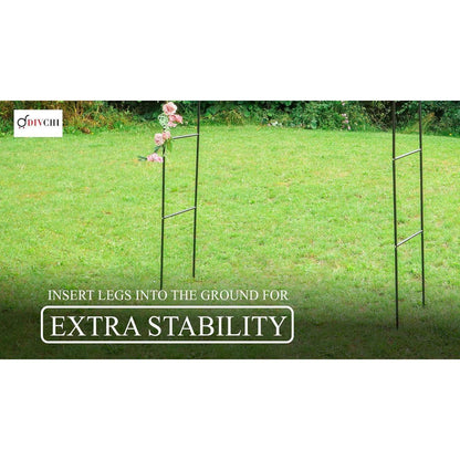 Metal garden arch legs inserted into the ground for added stability on grass